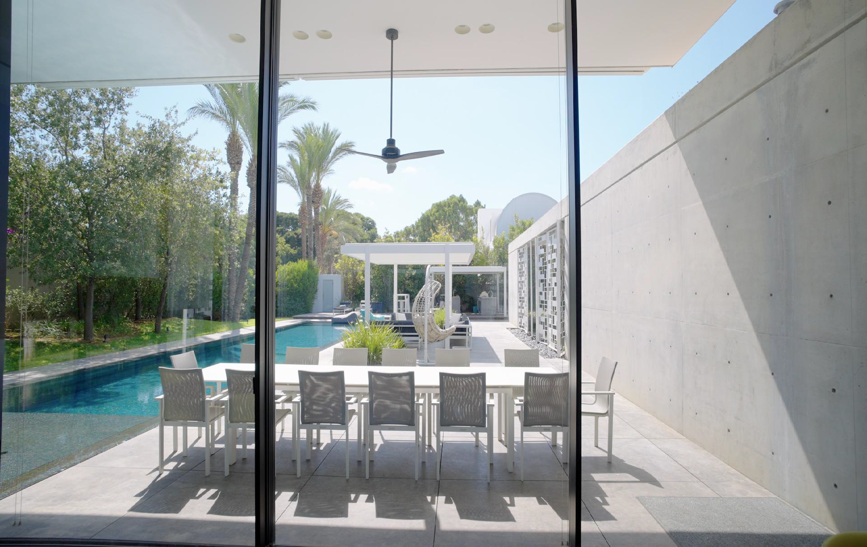 Luxury residence interior opening onto a pool in the Real Estate Promo